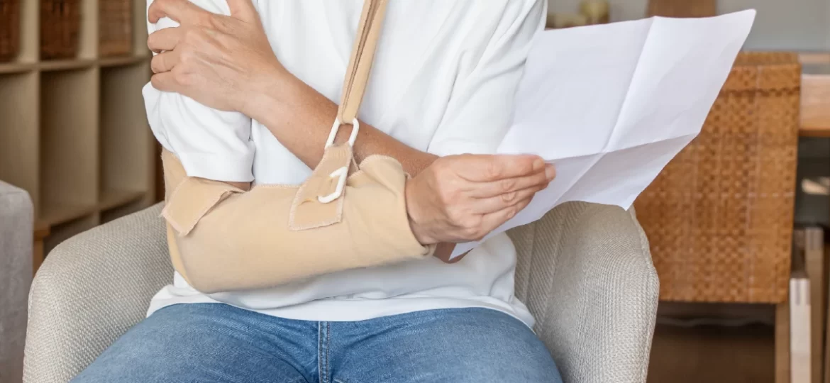 Personal injury to arm while looking at bill