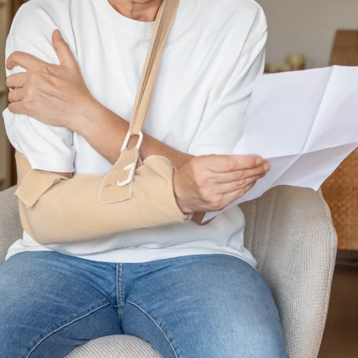 Personal injury to arm while looking at bill